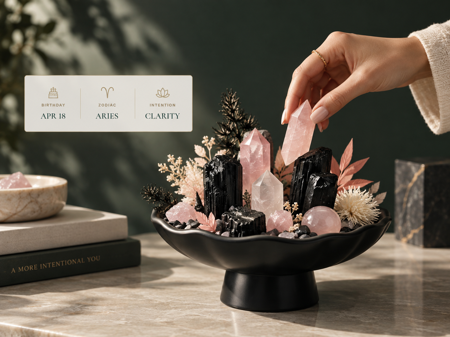 Hand selecting crystals beside a finished crystal garden